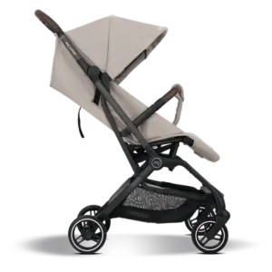 Side view of a beige baby stroller with a black frame, adjustable canopy, and a lower storage basket