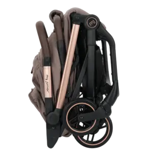 Folded baby stroller with a rose-gold frame and black wheels for storage or transport