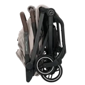 Folded baby stroller in beige and black, compact with wheels tucked in for transport or storage