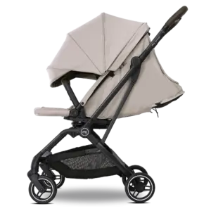 Beige baby stroller with black frame and storage basket underneath, side view profile for easy navigation or demo use