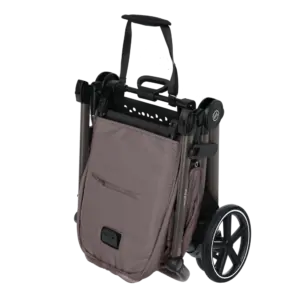 Folded compact wheelchair with taupe fabric bag attached, ready for transport.
