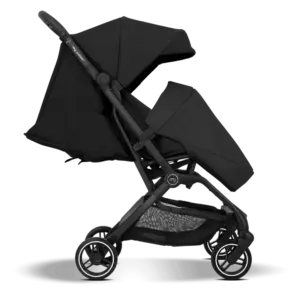 Black baby stroller in side view with extended canopy and mesh storage basket underneath.