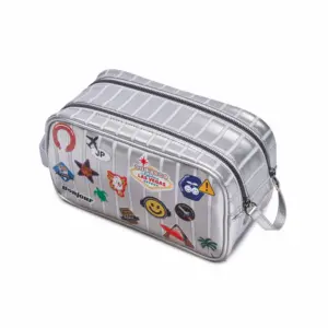 Silver rectangular travel pouch with zipper and wrist strap, covered in colorful travel stickers and patches.