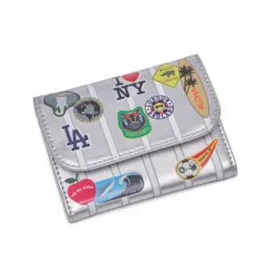 Silver wallet covered with colorful travel patches and stickers (I ♥ NY, LA, London, Hawaii, wildlife, sports icons)