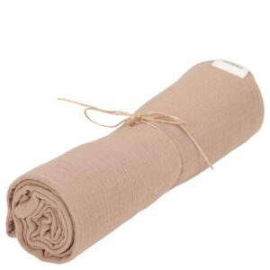 Beige rolled blanket or towel tied with twine for gift or storage