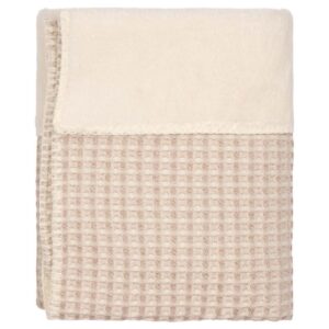 Folded beige waffle-texture towel with a cream-colored border on top edge.