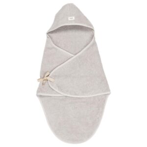 Soft gray hooded baby towel laid flat with a cross-over front and a small cream bow on the side