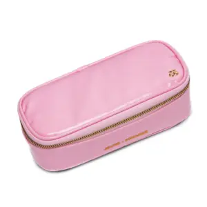 Pink rectangular zippered pencil case with a gold zipper and 'JEANNE PREMIER' branding on the side, angled view.